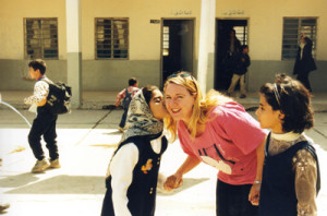 Donna Mulhearn is kissed by a Baghdad
schoolgirl a day before the 2003 invasion. Credit: Donna Mulhearn.