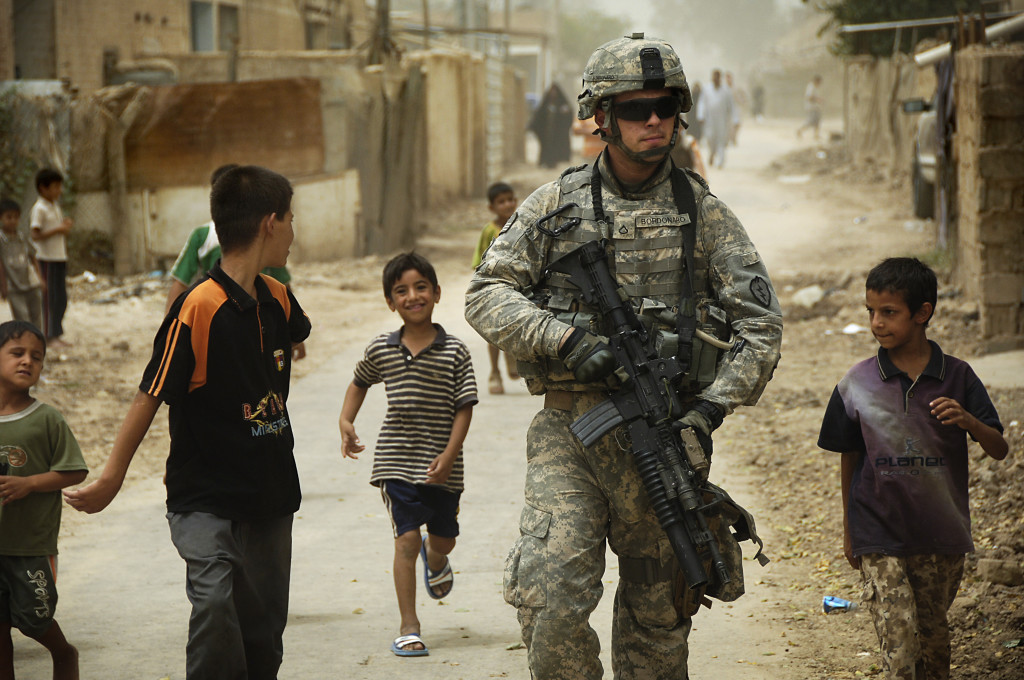 U.S. Army Pfc. Shane Bordonado patrols the streets of Al Asiriyah, Iraq, on Aug. 4, 2008