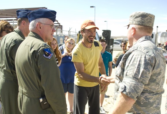 Robert Downey Jr. greets Col. Jerry Gandy, 95th Air Base Wing commander on the set of Iron Man II, which the Pentagon backed.