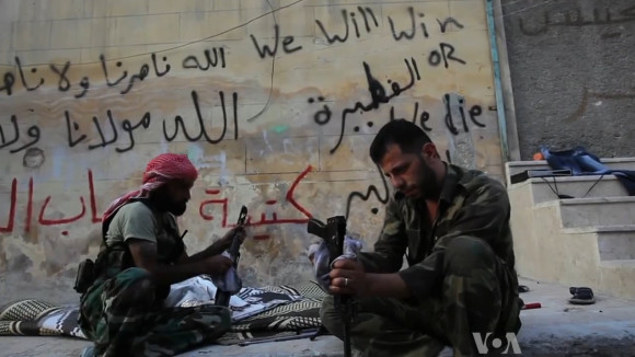 FSA_rebels_cleaning_their_AK47s