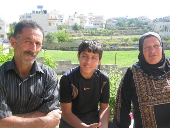 Zein Abu-Mariya (17) with his parents after nine months in Israeli custody. Credit: Pierre Klochendler/IPS.