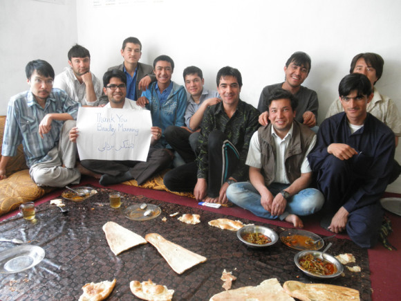 Afghan Peace Volunteers with a sign that thanks Bradley Manning. Credit: Hakim 