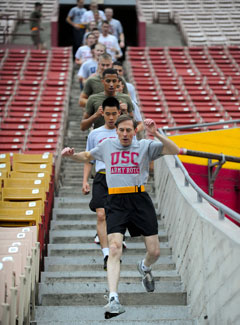 Former Gen. David Petraeus leads college kids in a run at University of Southern California where he landed a new post
