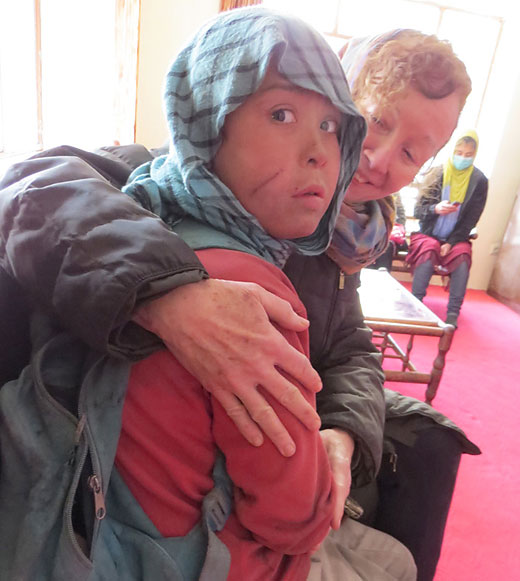Kathy Kelly with Safar, an Afghan "street child"