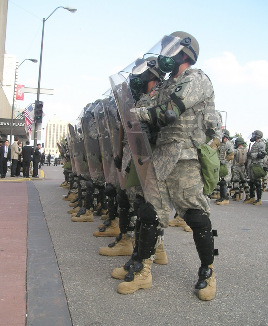 Martial law is not obvious to most people most of the time in the U.S., but military presence was evident on the streets, rooftops, and riverfront in St. Paul during the 2008 RNC political convention. Military was also used for crowd control at the DNC convention in Denver that year. Photo: Army News Service.