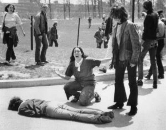 Mary Ann Vecchio gestures and screams as she kneels by the body of a student, Jeffrey Miller, lying face down on the campus of Kent State University, in Kent, Ohio.
